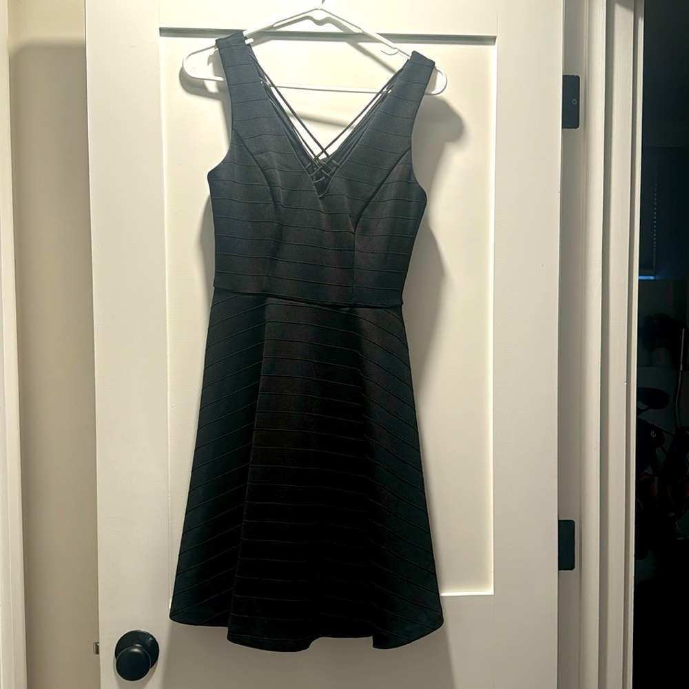 Black cocktail dress with front crisscross on chest